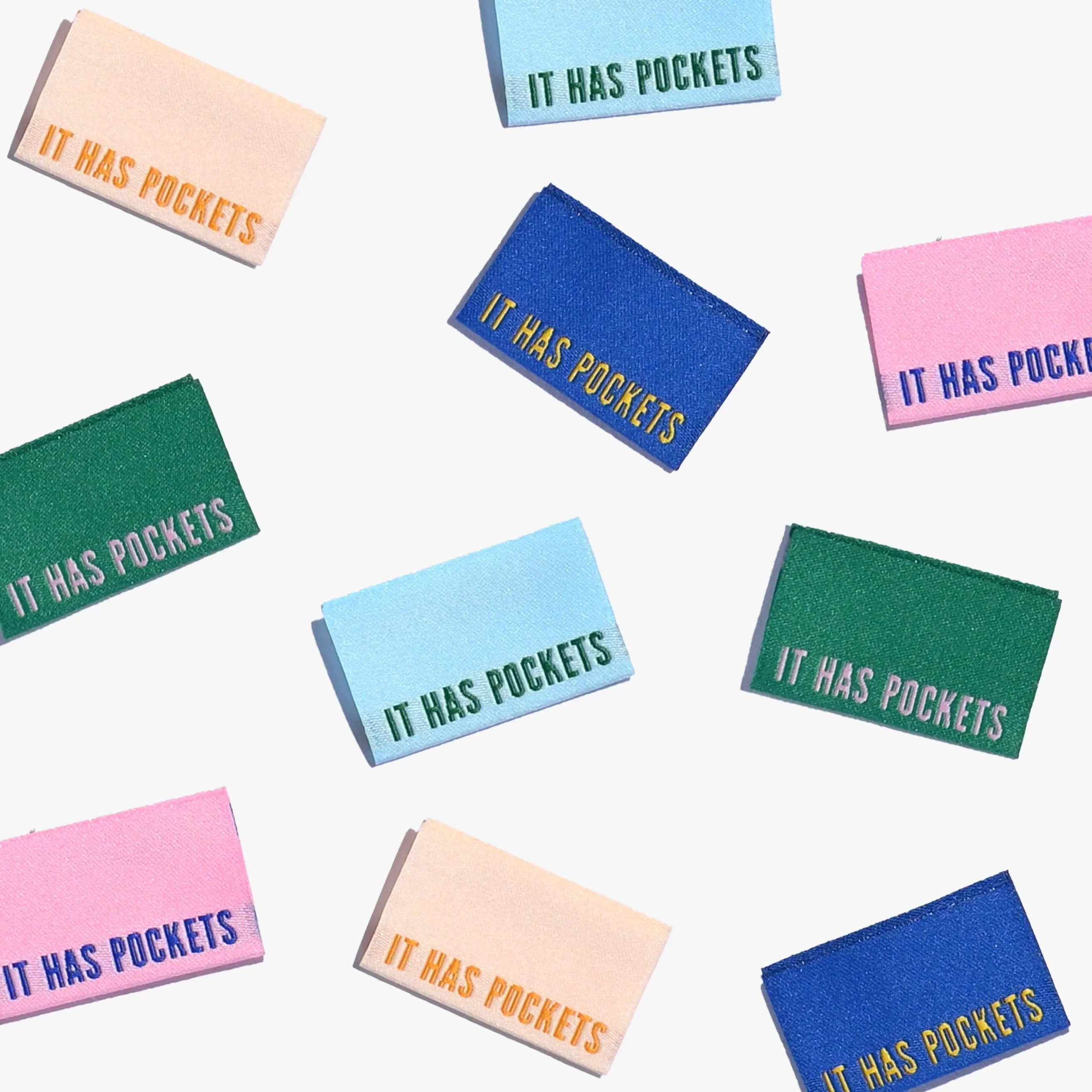 IT HAS POCKETS Woven Labels